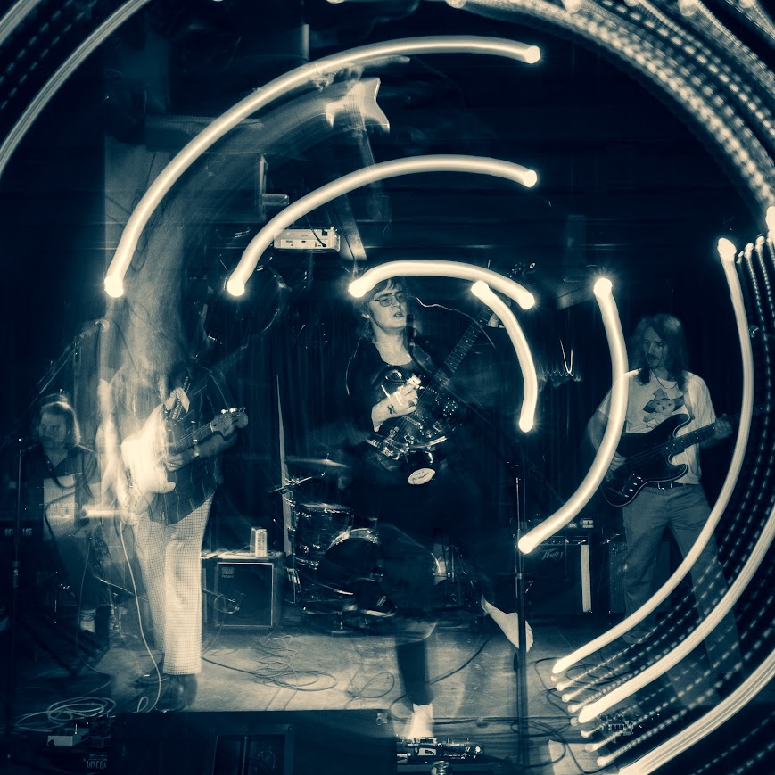 Quinn Decker playing live with his backing band, the Limited Liability Corporation